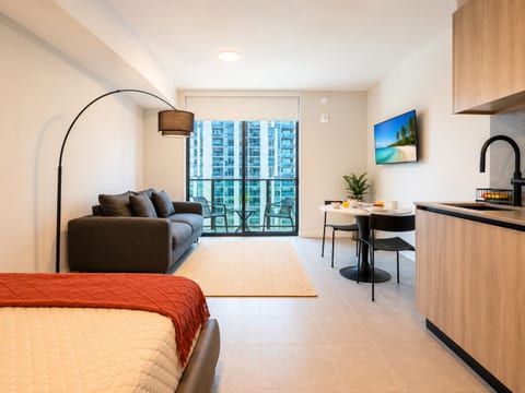Open-concept studio layout — living, dining & city views all in one elegant space on floor 34