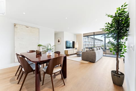 Bright modern living with dining for 6 and a balcony view