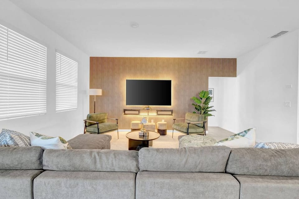 Unwind in our cozy living room, featuring a plush couch perfect for lounging and a smart TV for your favorite shows. Comfort meets convenience—your relaxing getaway starts here!