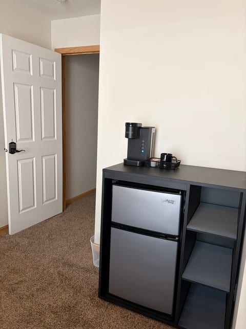 Spacious King Room A - Compact Fridge/ Keurig coffee maker station with storage.