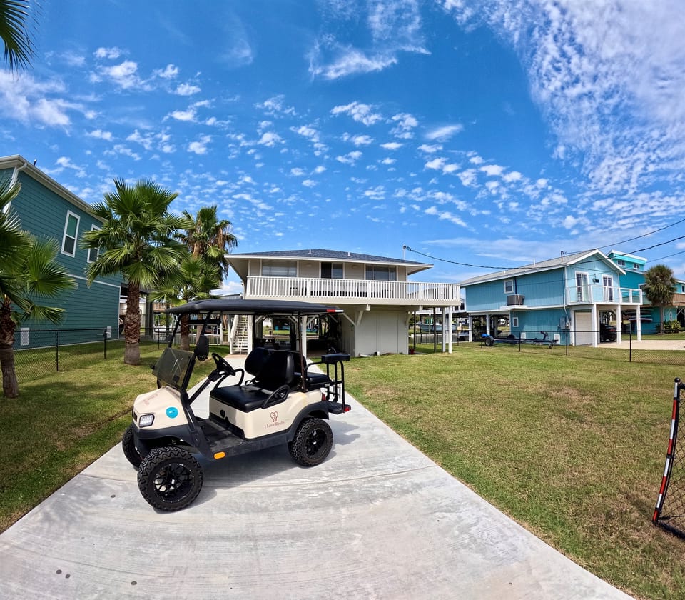 Front of the home with golf cart