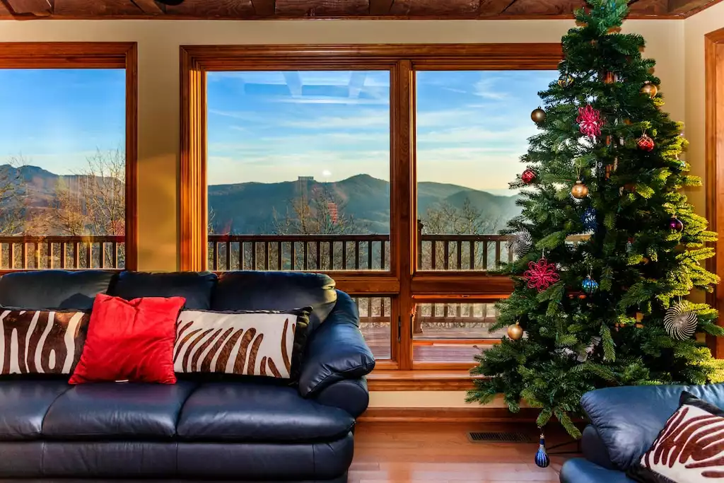 Living room with grandfather mountain and sugar ski resort view. - Summit Ridge 7 BR mountain home with 4 season view - Banner Elk