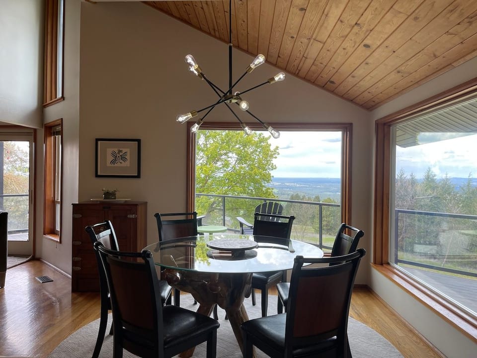 Bright Dining Room with Scenic Views: Table Seats Siix. Counter Bar Seats Three.