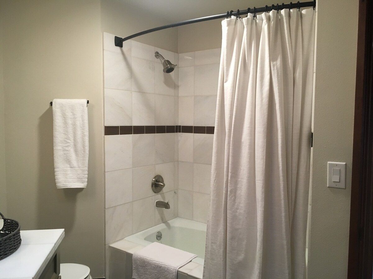 Spacious Bathroom with Tub Shower