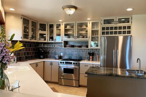 Chef's Kitchen with Premium Appliances: Everything you need for coffee and tea, plus spices for cooking.