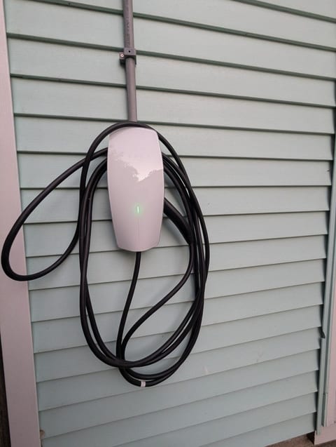Free driveway parking for multiple vehicles, plus a convenient EV charger for electric vehicles.