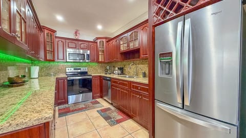Cook, gather, and enjoy: A fully equipped kitchen with modern appliances, perfect for preparing meals and making memories.