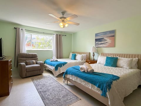 Spacious and cozy room with two comfy beds perfect for unwinding and sharing great moments after a sunny beach day