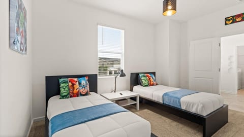 Superhero Sanctuary: Bright twin room with fun character décor and natural light! Perfect for kids!