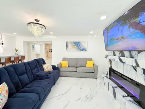 Living room with smart TV—cozy up for movie marathons after beach days.