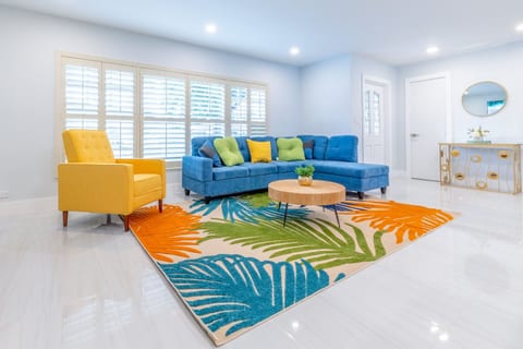 Bright living room with colorful accents—stylish space for gathering.