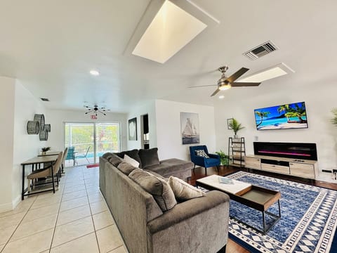 Spacious living area with pool views—perfect for family gatherings and relaxation.