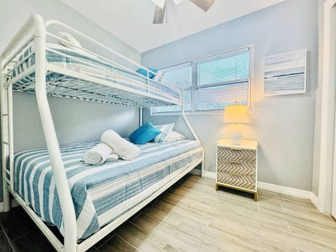 Family comfort in Lakeland, Florida! This bright bunk-bed room with striped bedding, soft towels & playful accents is perfect for kids, friends, or long-term guests seeking a clean, cheerful space to relax and recharge.