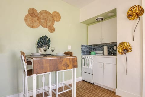 Cook, dine, and unwind at Hollywood, Florida! This cozy kitchen features stylish blue tile, a charming dining nook, and all essentials for a home-cooked meal. Perfect for couples, solo travelers, or long-term guests.
