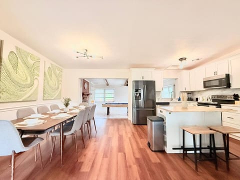 Open-concept kitchen, dining and game room view – fully equipped for your perfect Florida vacation at Oh Winter Heaven