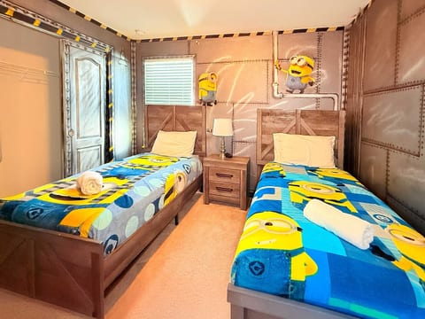 Minions-themed bedroom with bunk beds—kids will love this playful yellow paradise!