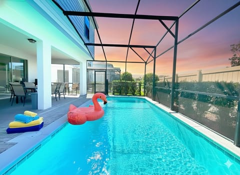 Poolside Paradise: Splash into fun with vibrant décor and a sunset view in your private oasis!