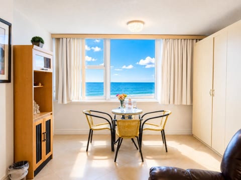 Bright dining nook with ocean views—enjoy breakfast while watching the waves roll in.