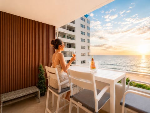 Stunning sunset views from your private balcony—toast to paradise with oceanfront champagne moments.