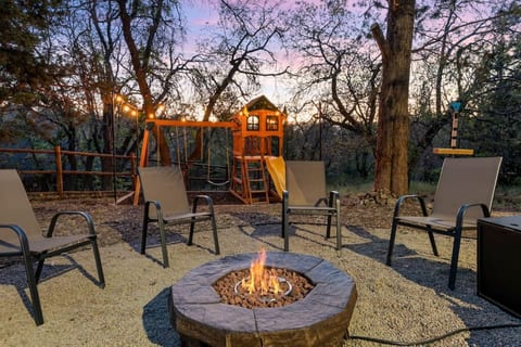 Outdoor seating area w/ firepit, made for evenings under the trees w/ friends & family.