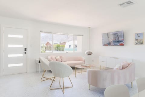 Bright, airy living space w/ cozy seating and clean lines for relaxing or gathering.