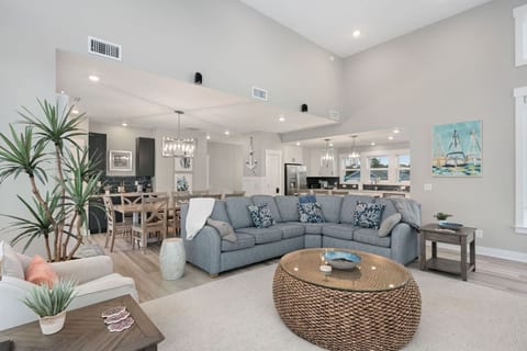 Bright living room w/ plush sectional, coastal accents & an easy, relaxed vibe.