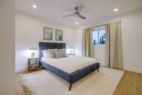 Relaxing bedroom w/ comfy bed, soft lighting & a calm layout made for easy rest.