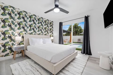 Serene bedroom retreat w/ crisp linens, bold accent wall & a calm, airy feel for restful nights.