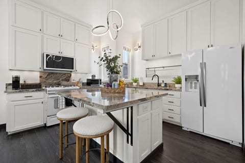 Modern kitchen w/ sleek cabinetry, ample counter space & everything needed to cook in.