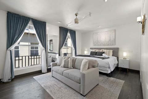 Elegant bedroom w/ classic details, soft drapes & a serene, hotel-style feel.