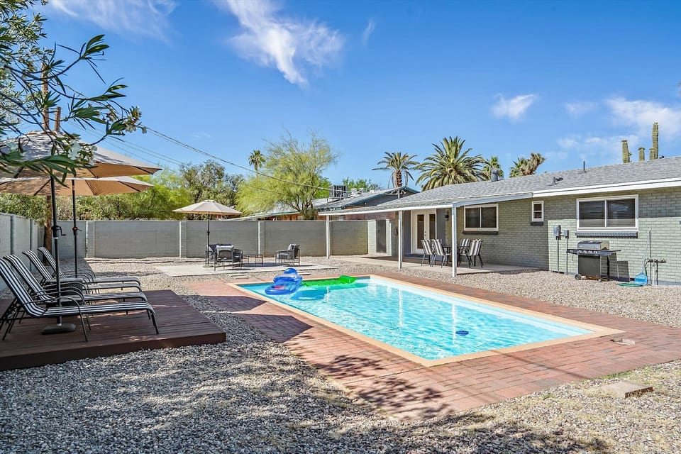 Private pool framed by desert landscaping, perfect for cooling off & soaking up the sun.