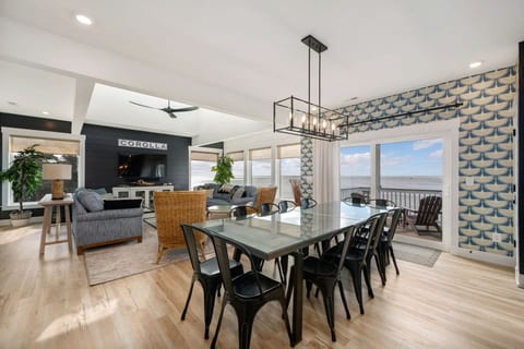 Spacious dining area w/ statement lighting, ample seating & an open layout made for group meals.