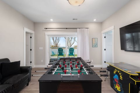 Fun-filled game room w/ comfy seating & space to unwind after a day outdoors