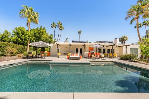 Spacious backyard pool area w/ multiple loungers & open sightlines for all-day sun.