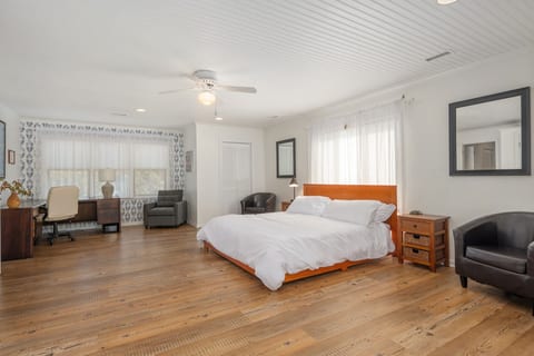 Calm bedroom w/ a cozy bed, soft linens, & simple decor for restful nights.