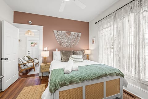 Calm bedroom retreat w/ soft tones, layered textures, & a peaceful vibe for winding down after full days out.