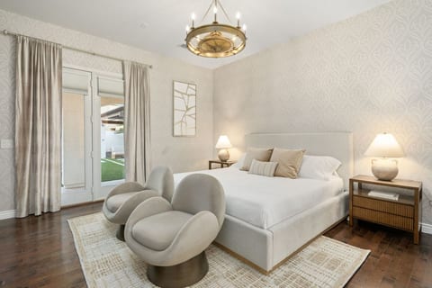 Serene bedroom retreat w/ soft textures, calming tones & an inviting place to unwind