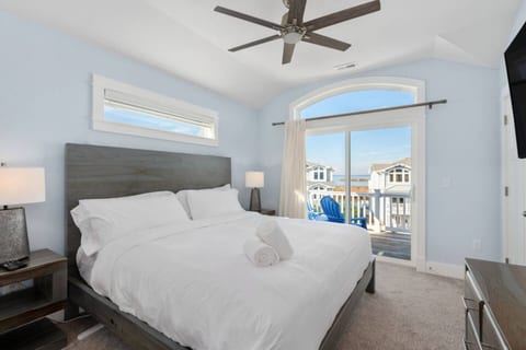 Airy bedroom w/ soft linens & coastal decor for restful nights
