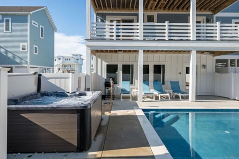Private backyard pool w/ lounge seating, perfect for cooling off after a sunny day.