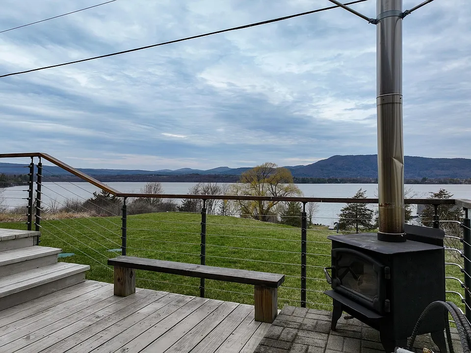 Outdoor fireplace located near the hot tub
