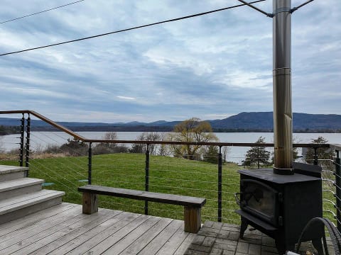 Outdoor fireplace located near the hot tub