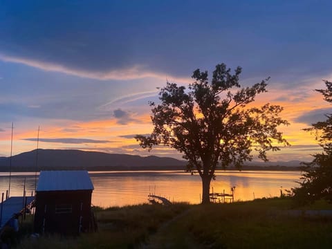 Dock and storage shed for kayaks and fire pit chairs