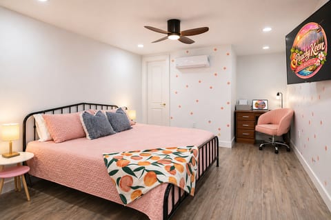 Spacious second primary suite with a king bed, 55” Smart TV, and dedicated workspace with printer and laptop. Enjoy year-round comfort with mini-split AC and unwind in the ensuite bath featuring a sleek walk-in shower with multi-function panel.