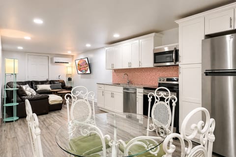 Open-concept living brings everyone together—seamlessly connecting the kitchen, dining, game room, and lounge areas for easy conversation, shared meals, and family fun, all in one spacious and thoughtfully designed layout.