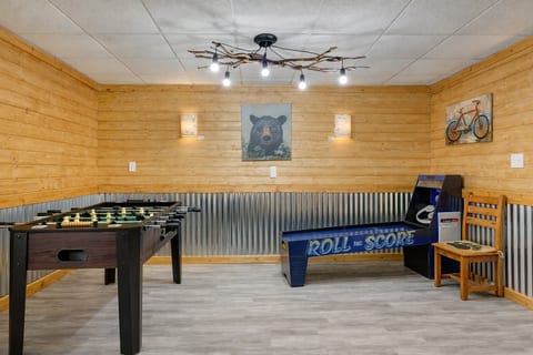 Rustic game room with foosball & roll‑and‑score fun for all ages