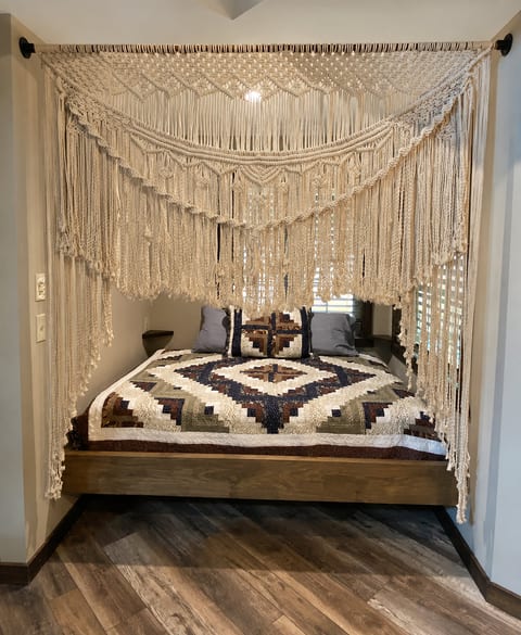 Cozy boho sleeping nook with a stunning macramé canopy bed