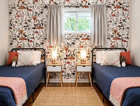 Experience comfort in our twin bed room equipped with a 40” smart TV for entertainment. Relax in the cozy ambiance with a side chair for added convenience and relaxation.