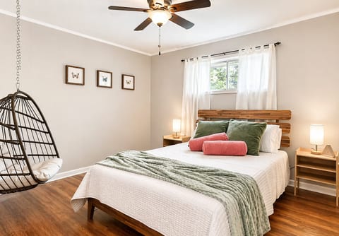Bedroom 2: Queen bed, 40” smart TV, hanging egg chair—your cozy retreat near Stone Mountain and Atlanta.