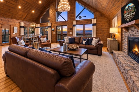 Cozy mountain great room with fireplace and stunning sunset views
