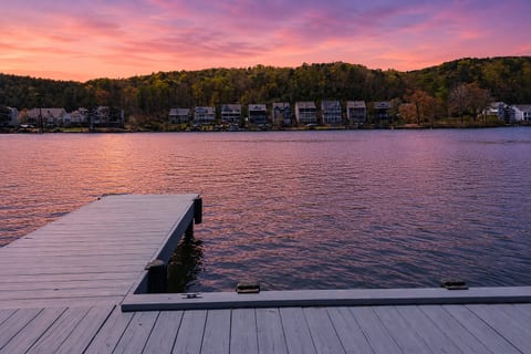 Private dock with serene lake views and stunning sunset skies